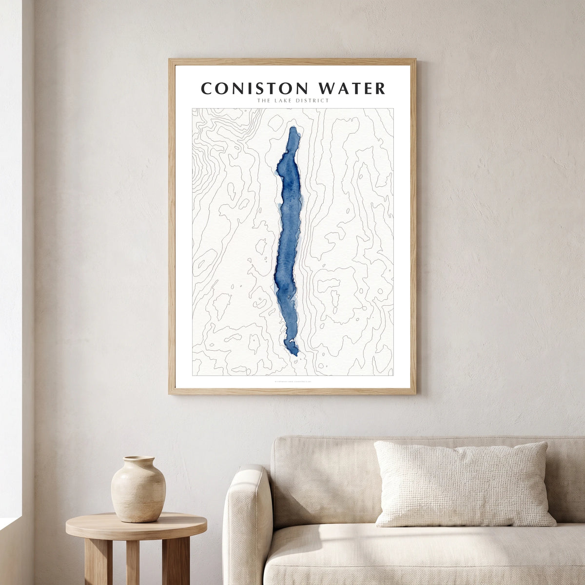 Coniston Water lake map poster in a natural frame, hanging in a living