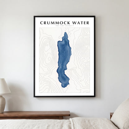 Crummock Water lake map poster in a black frame, hanging in a bedroom