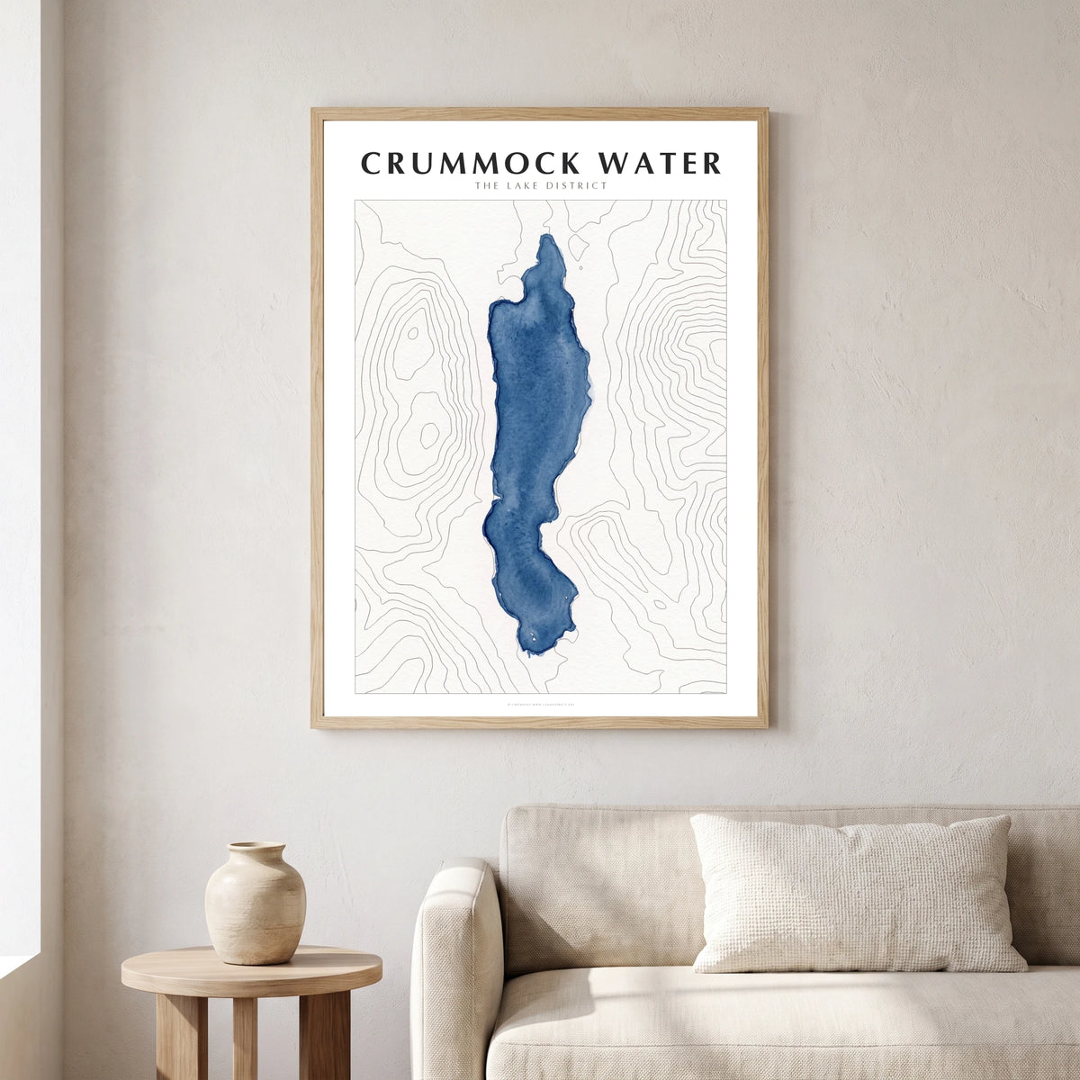 Crummock Water lake map poster in a natural frame, hanging in a living