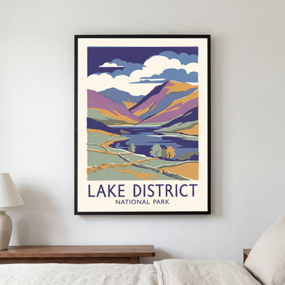 Lake District travel poster in a black frame, hanging in a bedroom3