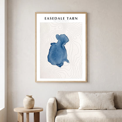 Easedale Tarn lake map poster in a natural frame, hanging in a living