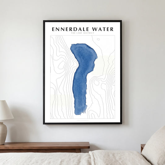 Ennerdale Water lake map poster in a black frame, hanging in a bedroom