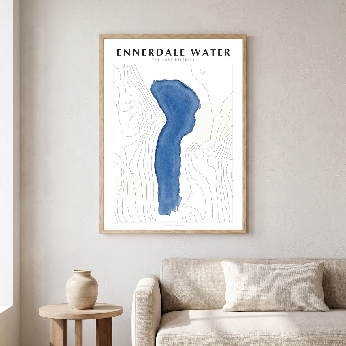 Ennerdale Water lake map poster in a natural frame, hanging in a living