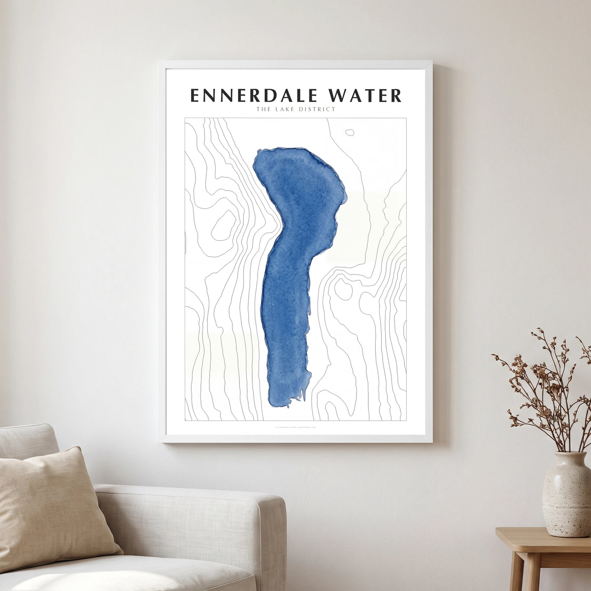 Ennerdale Water lake map poster in a white frame, hanging in a living
