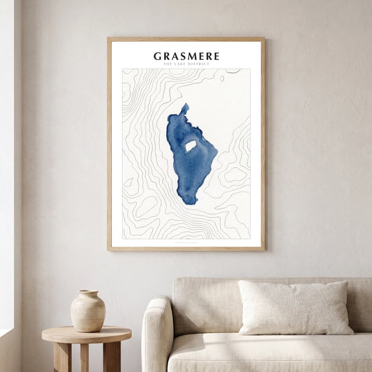 Grasmere lake map poster in a natural frame, hanging in a living