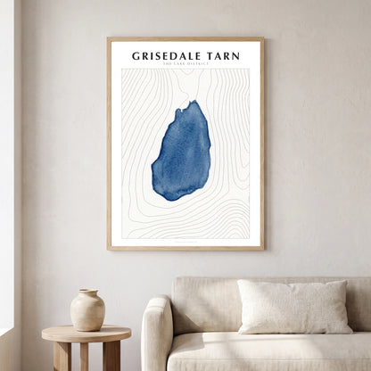 Grisedale Tarn lake map poster in a natural frame, hanging in a living
