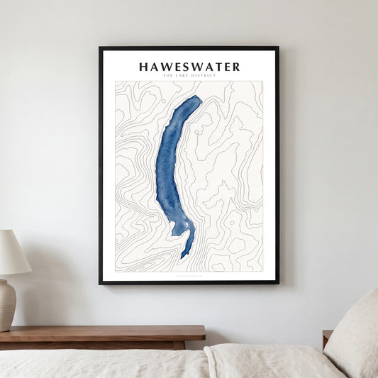 Haweswater lake map poster in a black frame, hanging in a bedroom