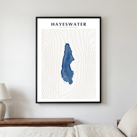 Hayeswater lake map poster in a black frame, hanging in a bedroom