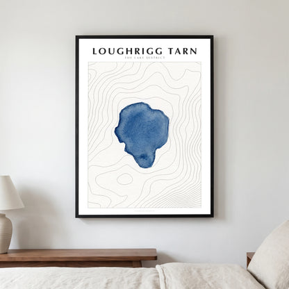 Loughrigg Tarn lake map poster in a black frame, hanging in a bedroom