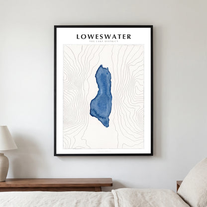 Loweswater lake map poster in a black frame, hanging in a bedroom
