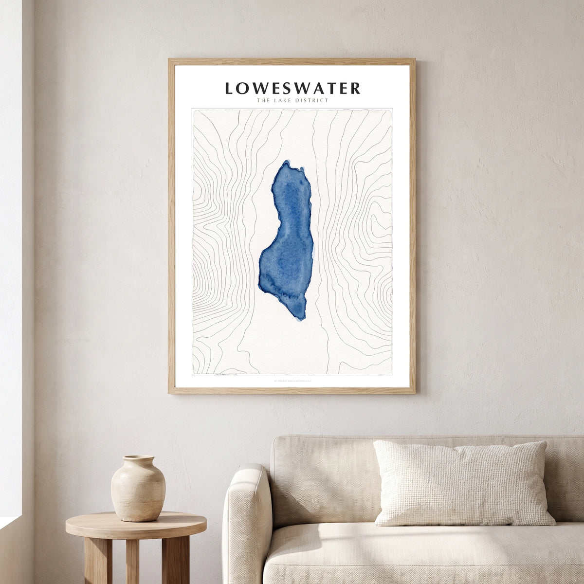 Loweswater lake map poster in a natural frame, hanging in a living