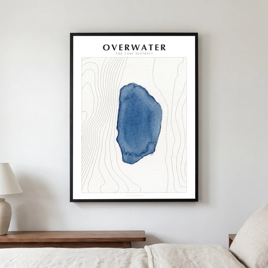 Overwater lake map poster in a black frame, hanging in a bedroom