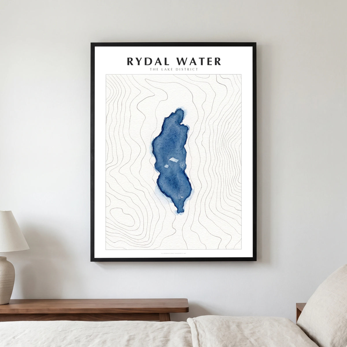 Rydal Water lake map poster in a black frame, hanging in a bedroom