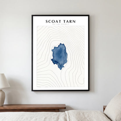 Scoat Tarn lake map poster in a black frame, hanging in a bedroom