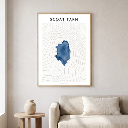 Scoat Tarn lake map poster in a natural frame, hanging in a living