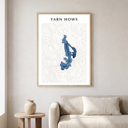 Tarn Hows lake map poster in a natural frame, hanging in a living