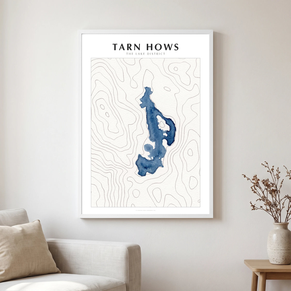 Tarn Hows lake map poster in a white frame, hanging in a living