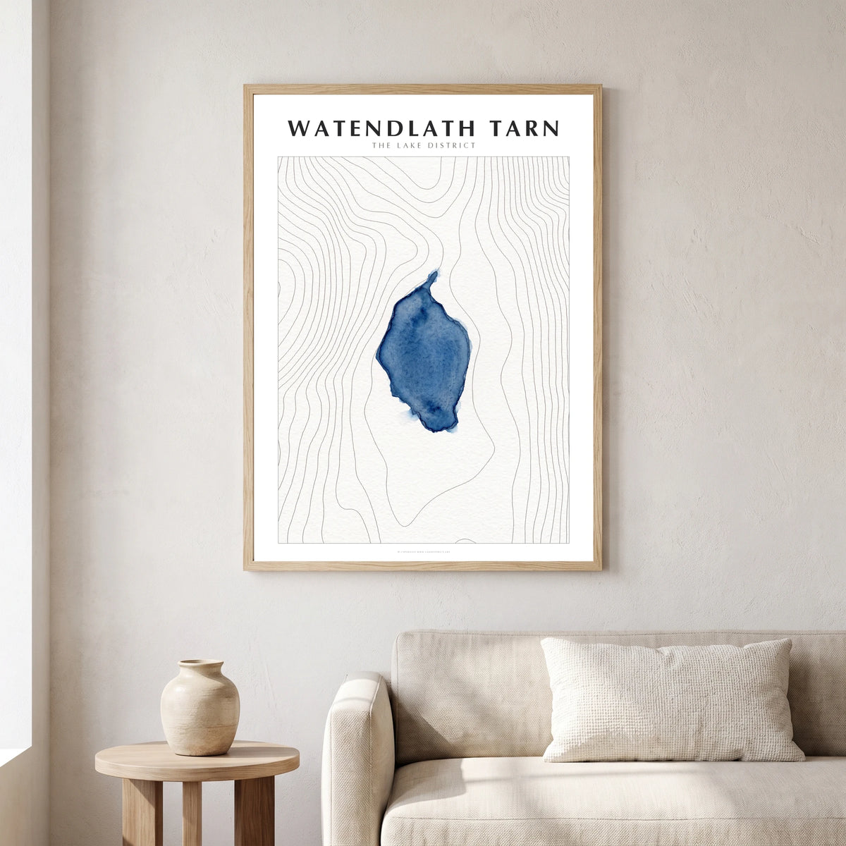 Watendlath Tarn lake map poster in a natural frame, hanging in a living