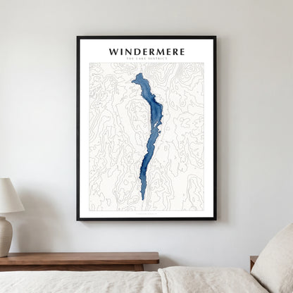 Windermere lake map poster in a black frame, hanging in a bedroom