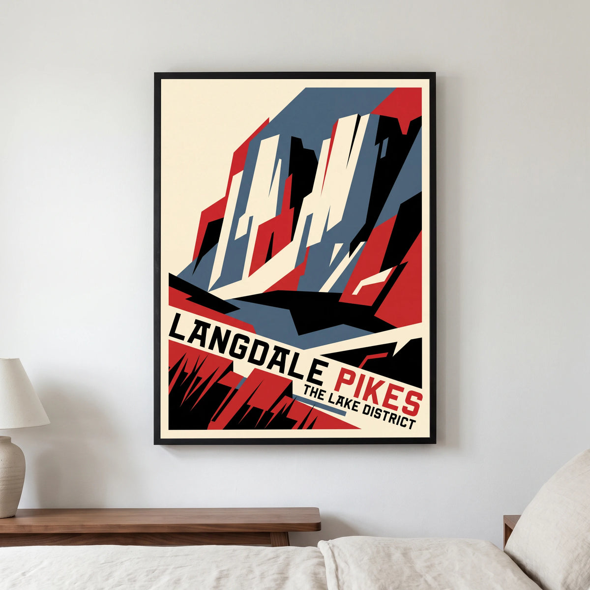 Langdale Pikes travel poster in a black frame, hanging in a bedroom3