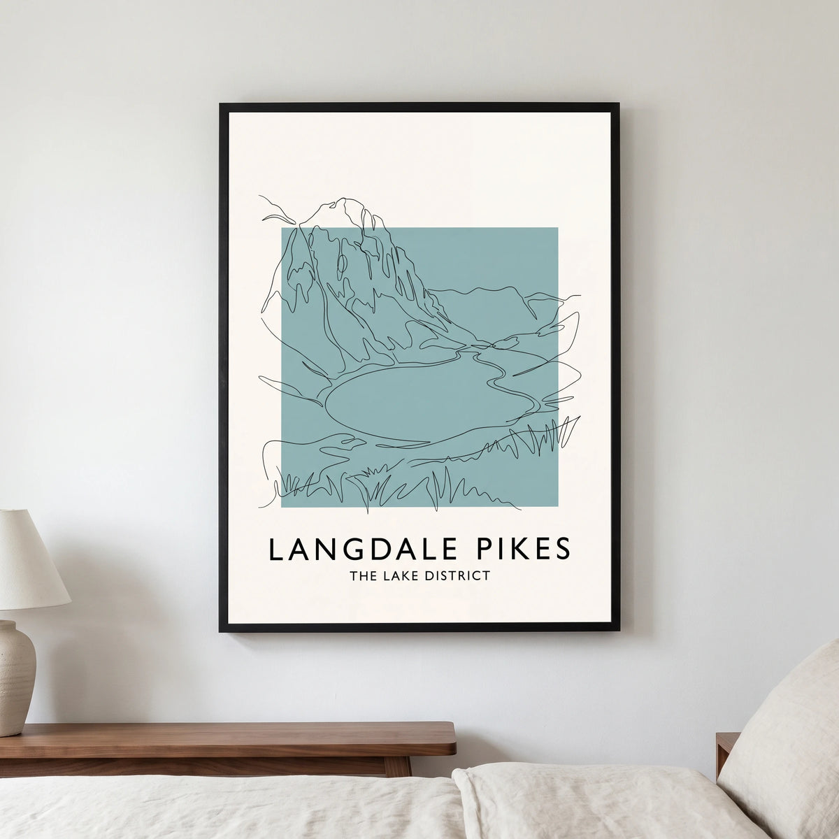 Langdale Pikes travel poster in a black frame, hanging in a bedroom3