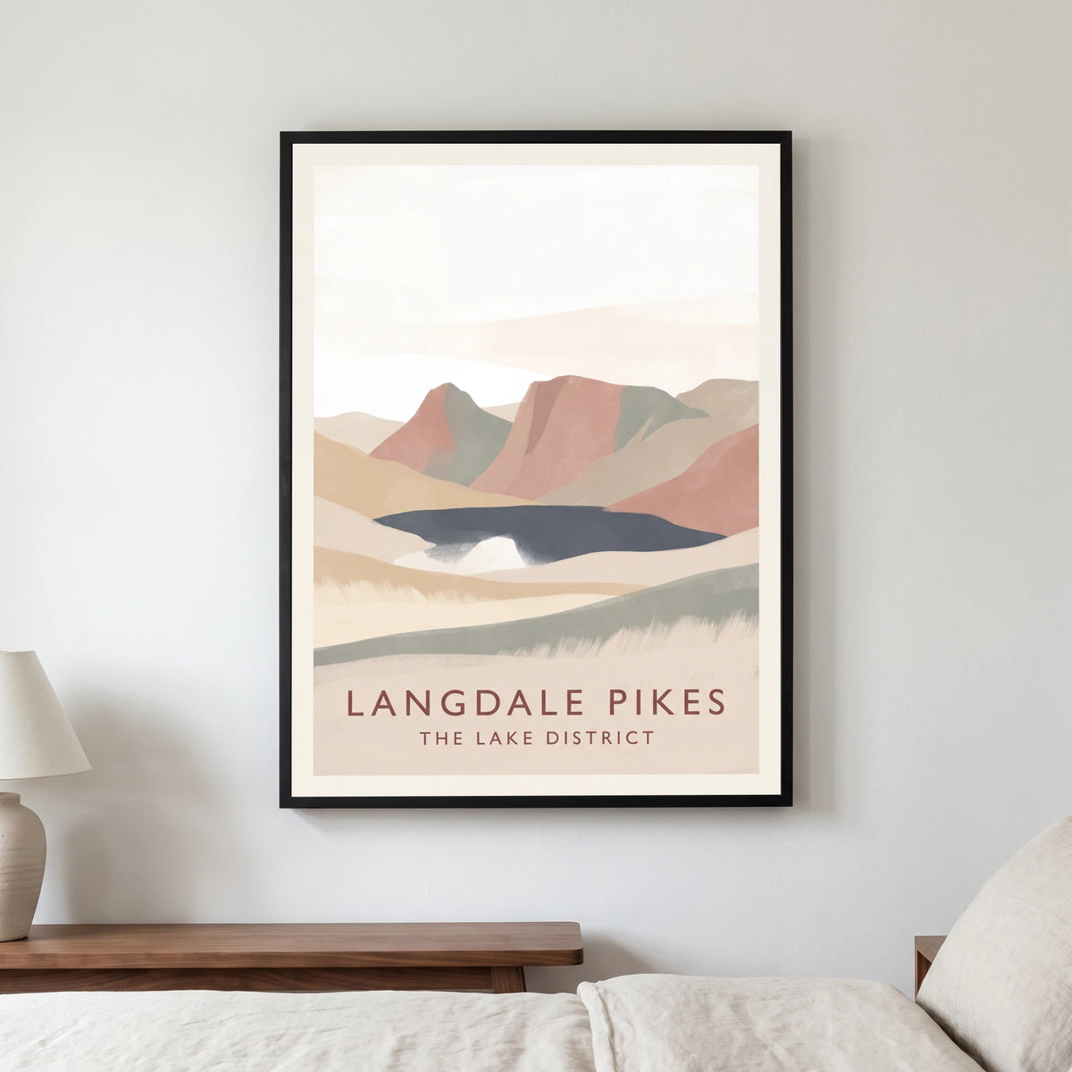 Langdale Pikes travel poster in a black frame, hanging in a bedroom3