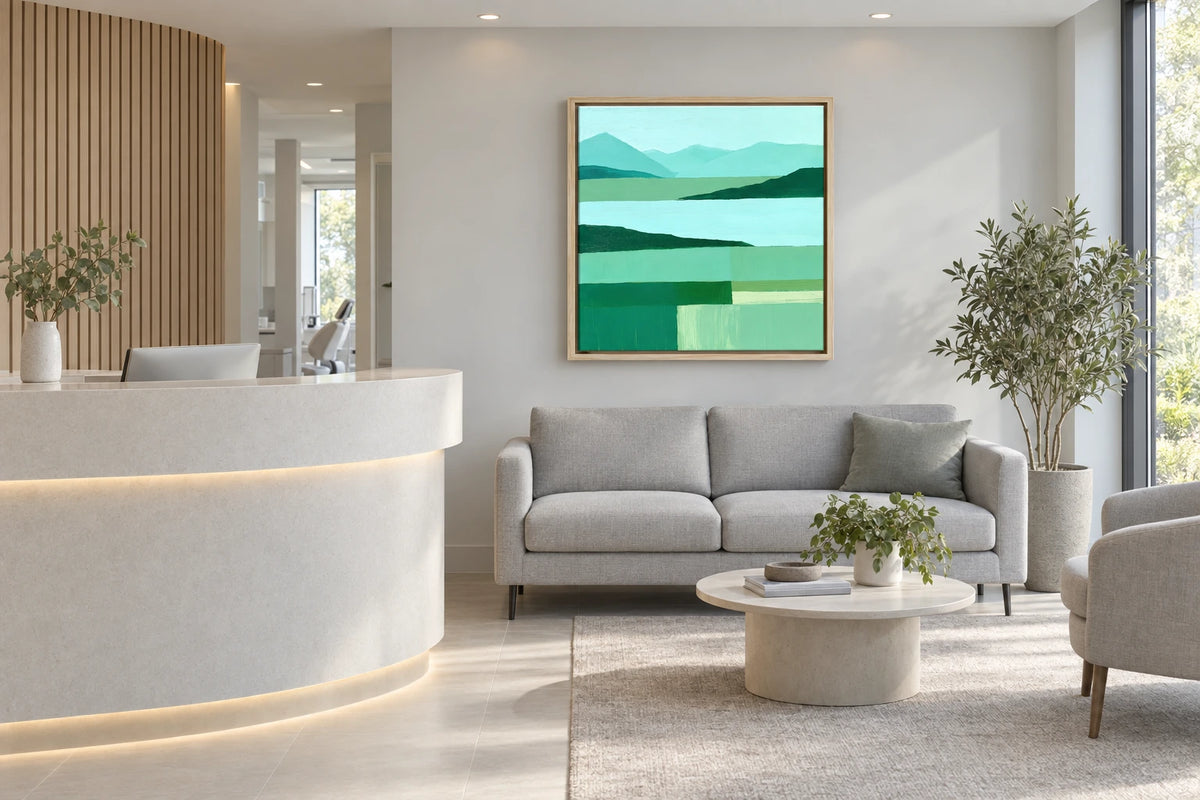 A framed Coniston Water painting hanging in dental practice