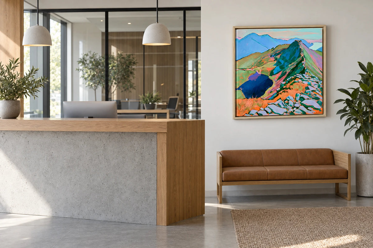 A framed Striding Edge painting hanging in office reception