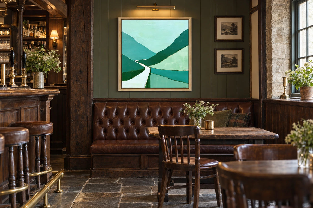 A framed Honister Pass painting hanging in village pub