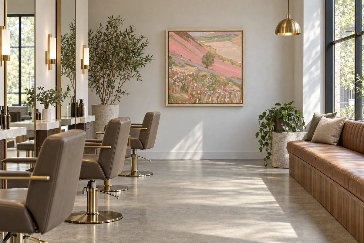 A framed Crummock Water painting hanging in hair salon