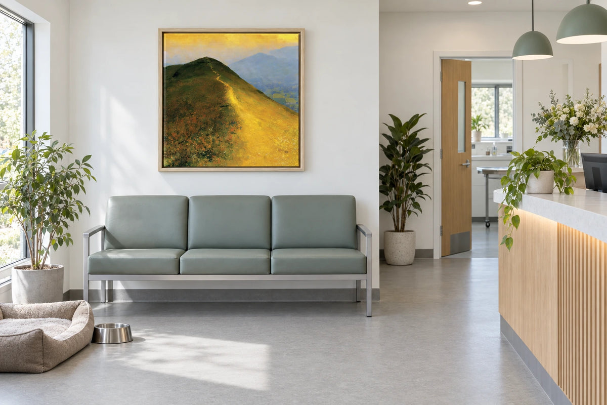A framed Cat Bells painting hanging in veterinary practice