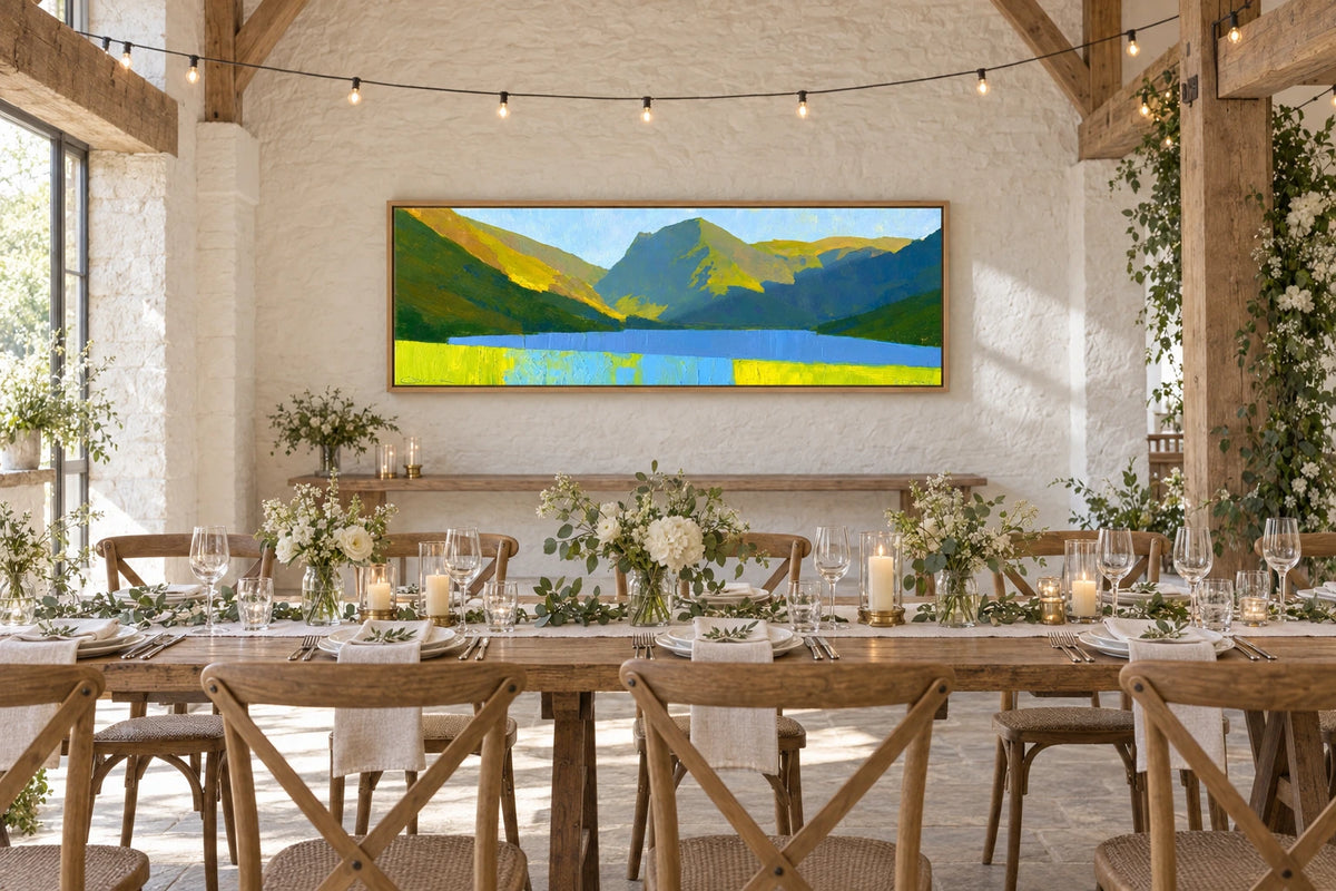 A framed Buttermere painting hanging in wedding venue
