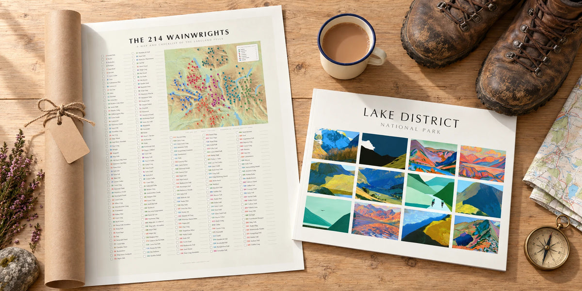 Lake District gifts for walkers: the 214 Wainwrights checklist poster half unrolled from a kraft tube beside a 2027 wall calendar, walking boots, map, compass and tea