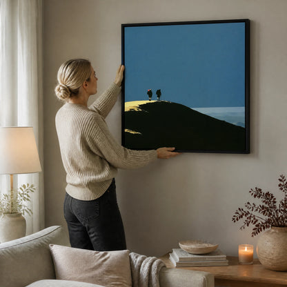 Silhouetted Hikers on a Fell Top — Framed Canvas · Black · 90cm shown in a home interior
