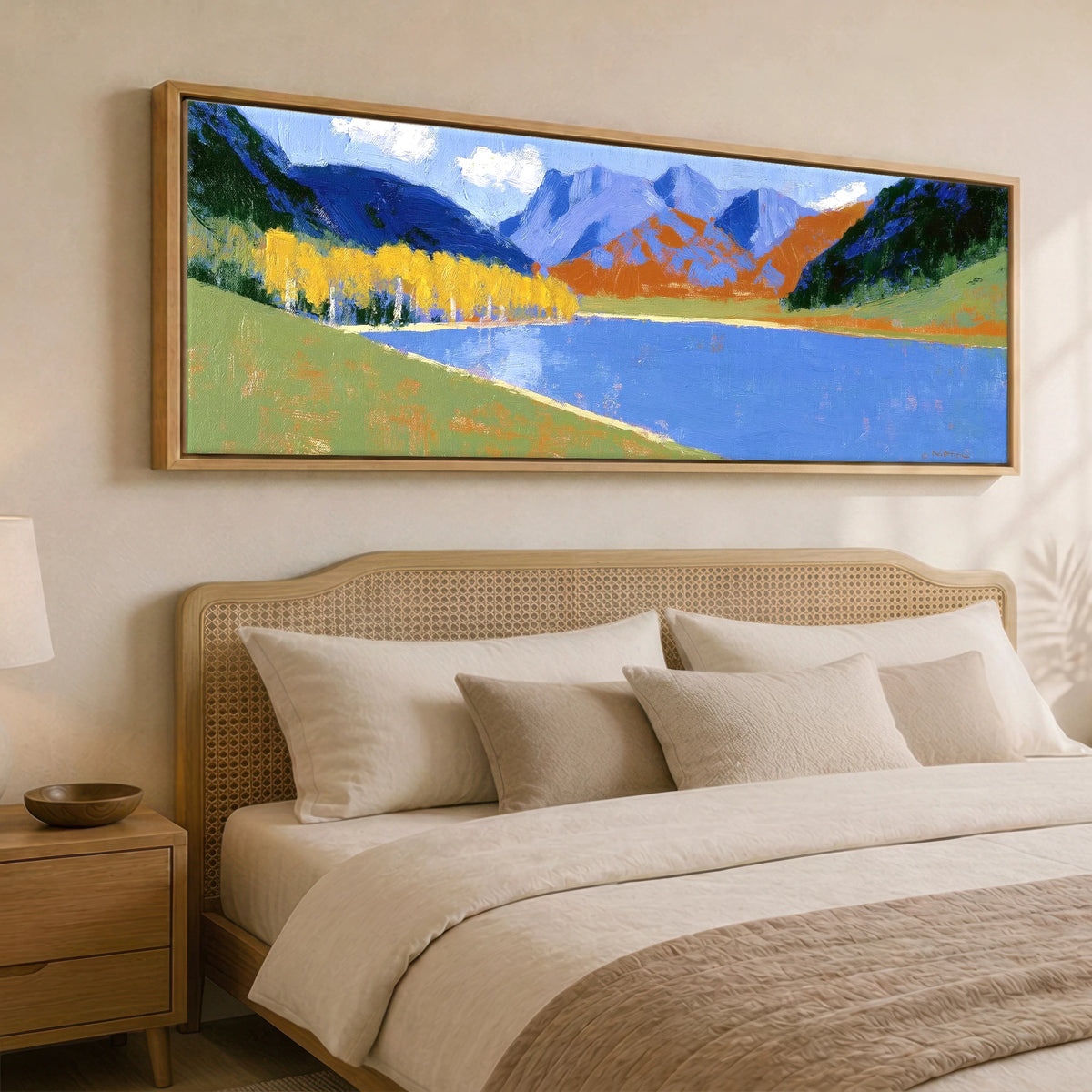 Bold Autumn Colours at Blea Tarn Lake District Lake panoramic canvas wall art displayed above a bed