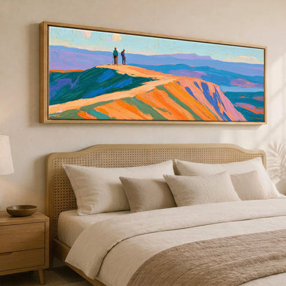 Hikers on a Radiant Fell Top Lake District Fell panoramic canvas wall art displayed above a bed