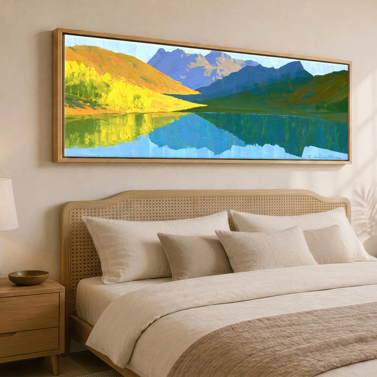 Sunlit Fells over Crummock Water Reflection Lake District Lake panoramic canvas wall art displayed above a bed
