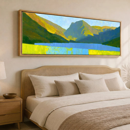 Luminous Fells Over Sapphire Water Lake District Lake panoramic canvas wall art displayed above a bed