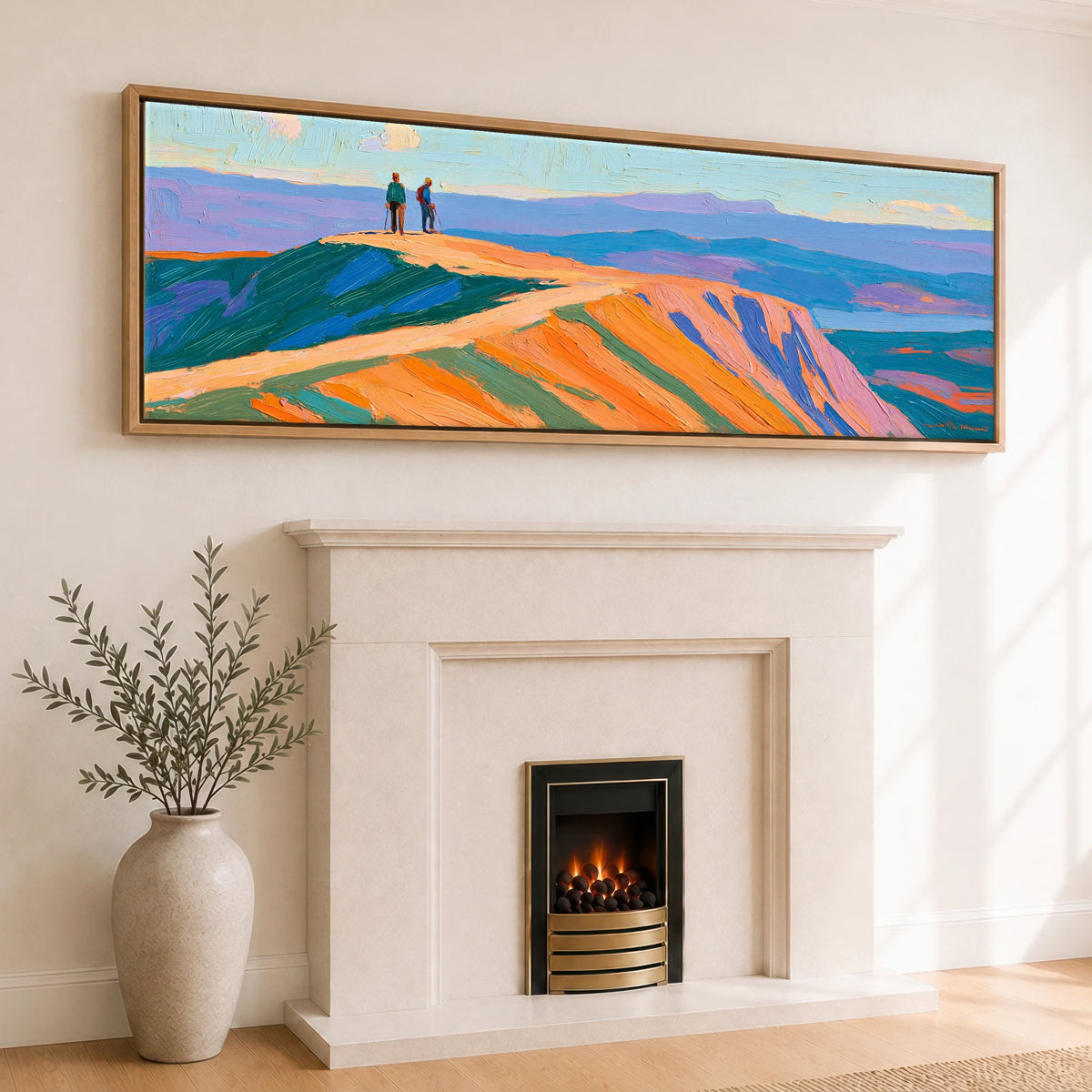 Hikers on a Radiant Fell Top Lake District Fell panoramic canvas wall art displayed above a fireplace