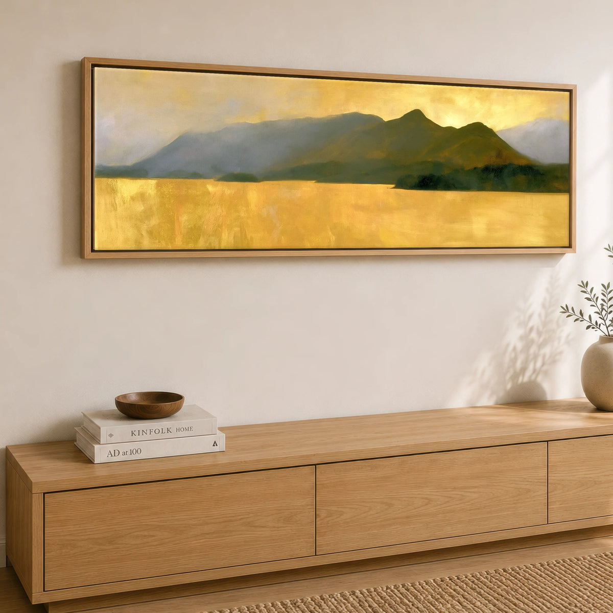 Catbells Silhouette in Luminous Gold Lake District Fell panoramic canvas wall art displayed above a sideboard