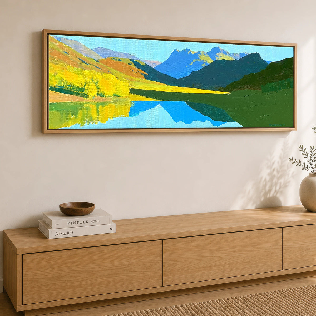 Luminous Fells and Azure Reflections Lake District Lake panoramic canvas wall art displayed above a sideboard