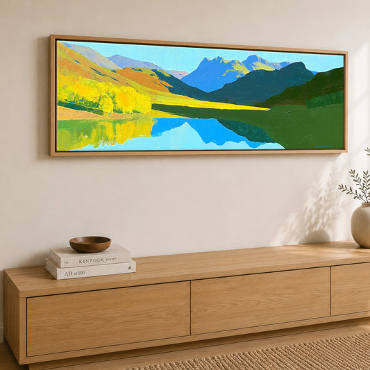 Luminous Fells and Azure Reflections Lake District Lake panoramic canvas wall art displayed above a sideboard