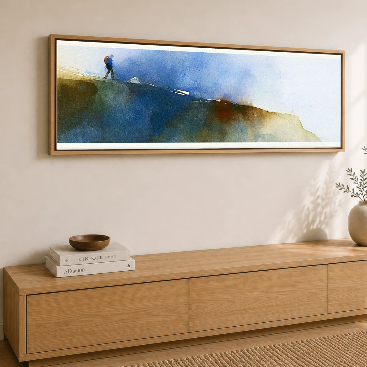 Fell Walker on Moody Striding Edge Lake District Walking panoramic canvas wall art displayed above a sideboard