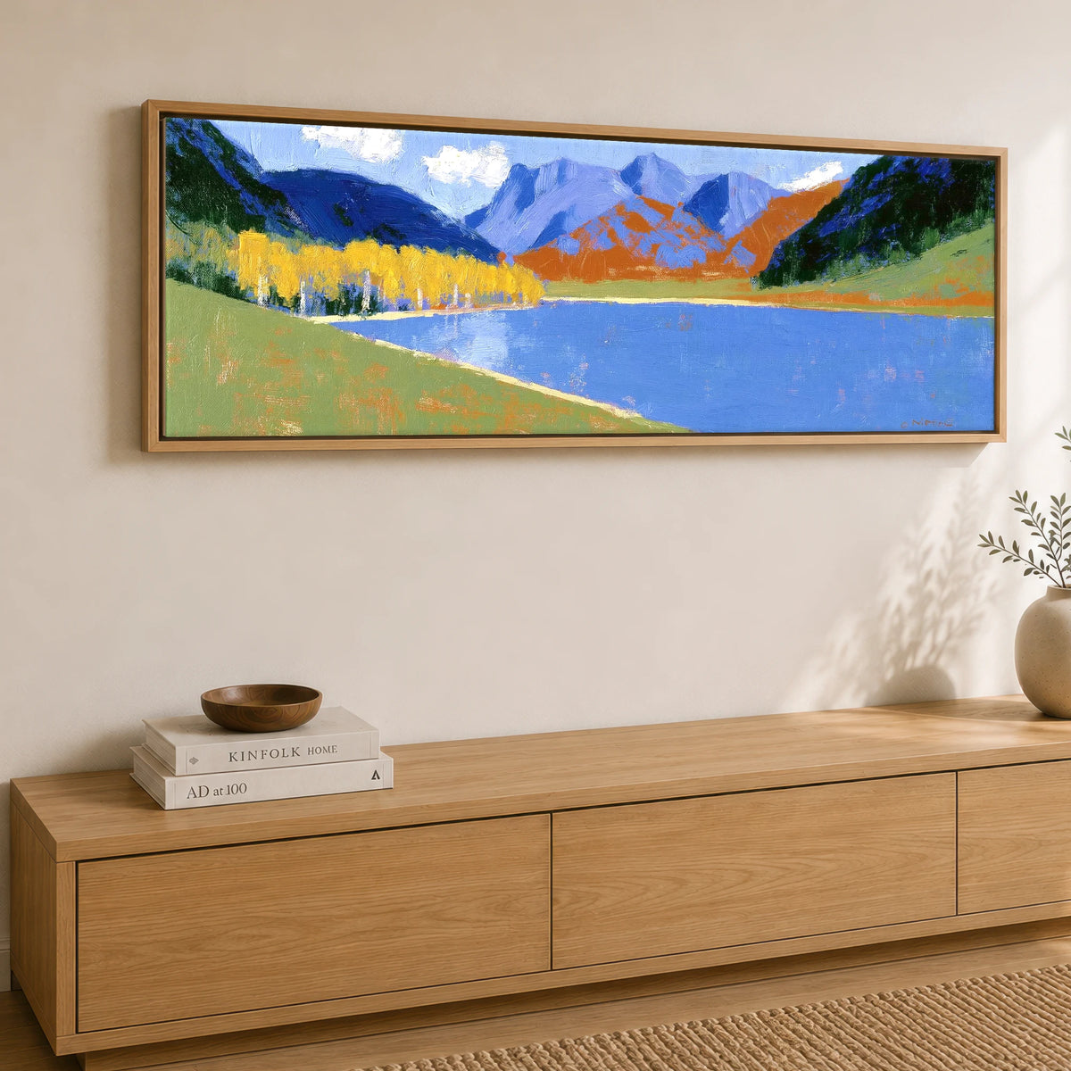 Bold Autumn Colours at Blea Tarn Lake District Lake panoramic canvas wall art displayed above a sideboard