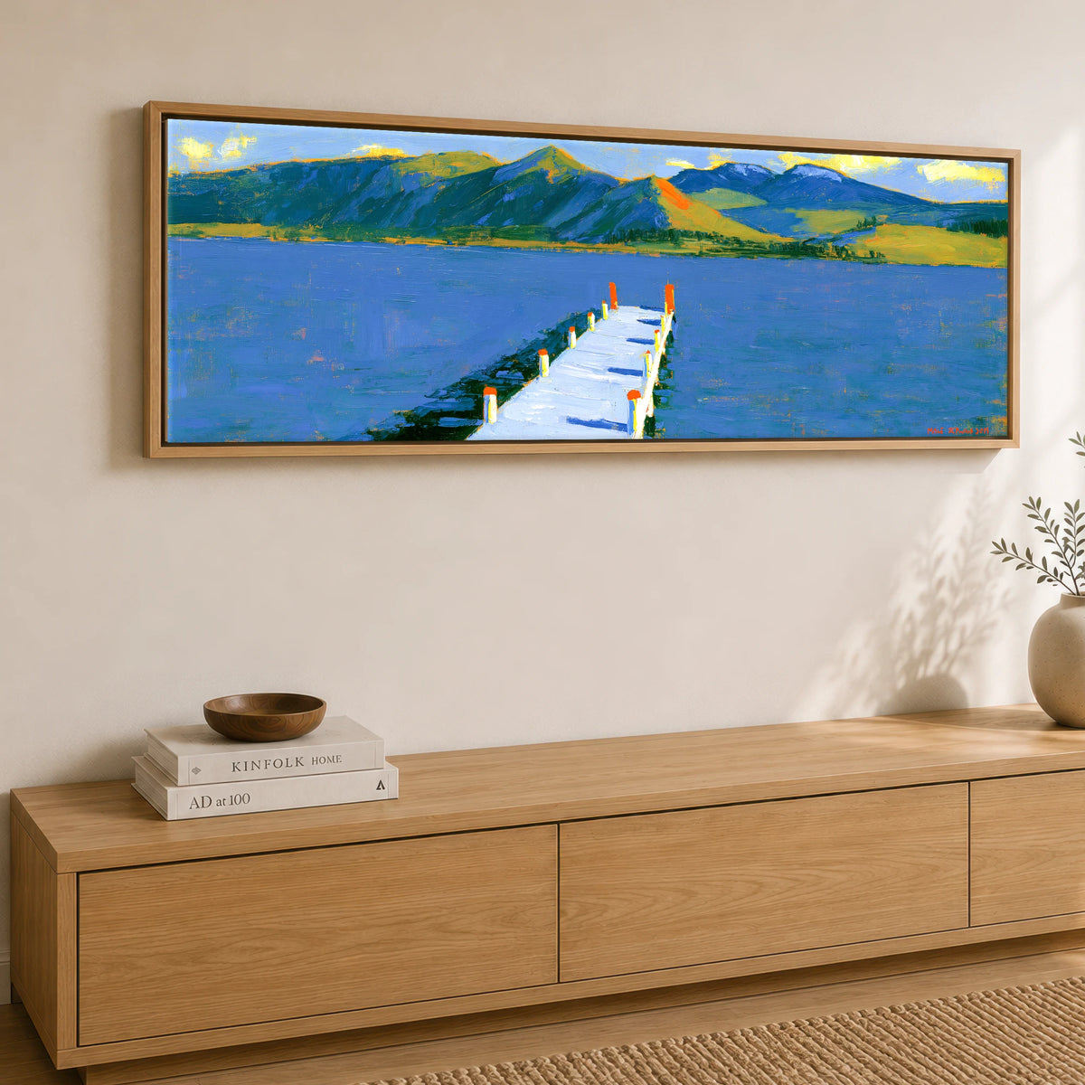Derwentwater Jetty in Vibrant Light Lake District Lake panoramic canvas wall art displayed above a sideboard