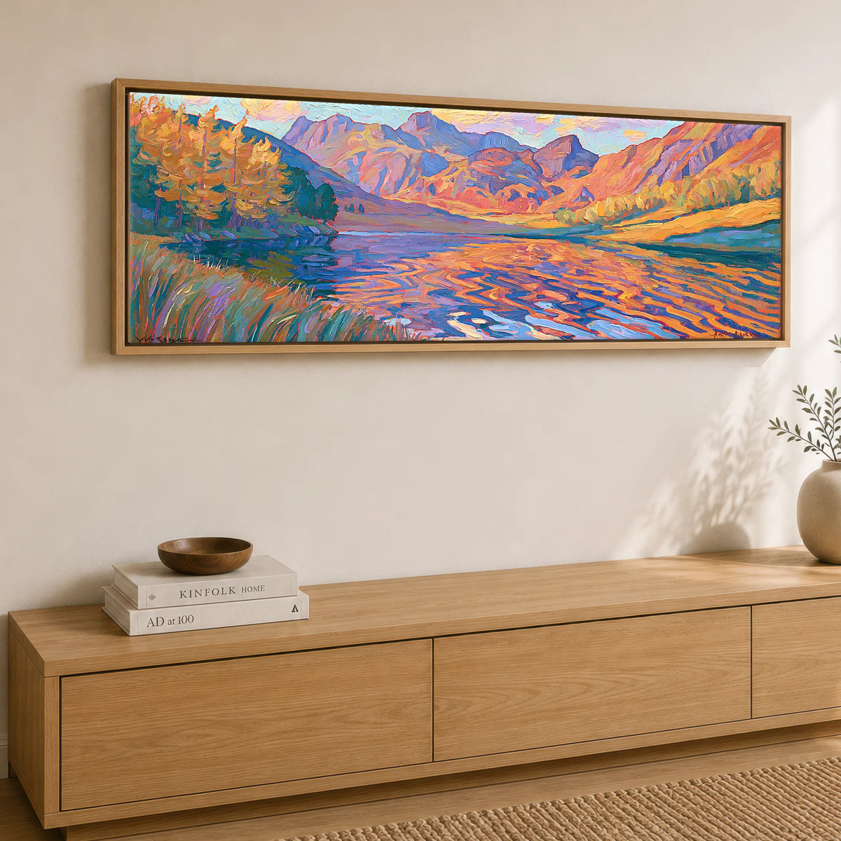 Vibrant Autumn Lakeland Tarn at Sunset Lake District Lake panoramic canvas wall art displayed above a sideboard