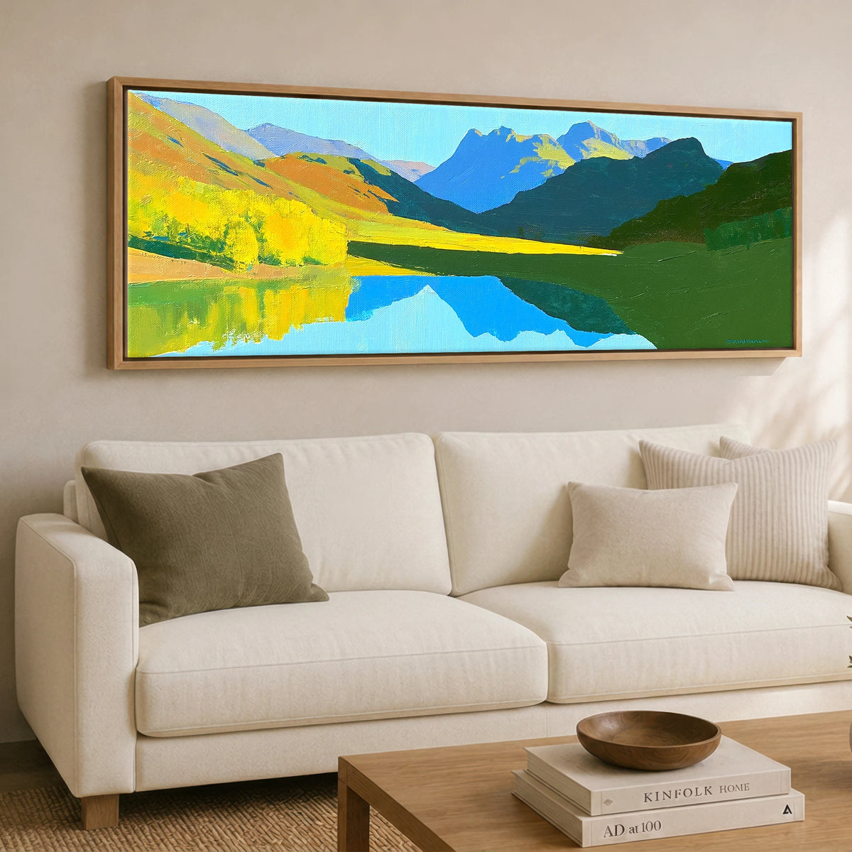 Luminous Fells and Azure Reflections Lake District Lake panoramic canvas wall art displayed above a sofa