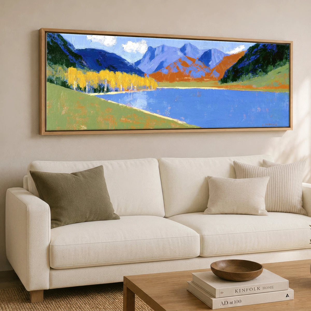 Bold Autumn Colours at Blea Tarn Lake District Lake panoramic canvas wall art displayed above a sofa