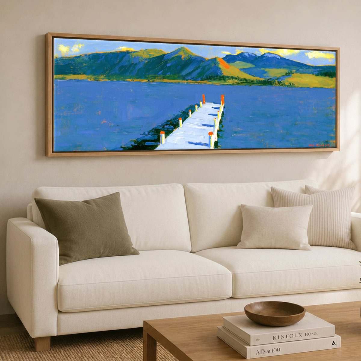 Derwentwater Jetty in Vibrant Light Lake District Lake panoramic canvas wall art displayed above a sofa