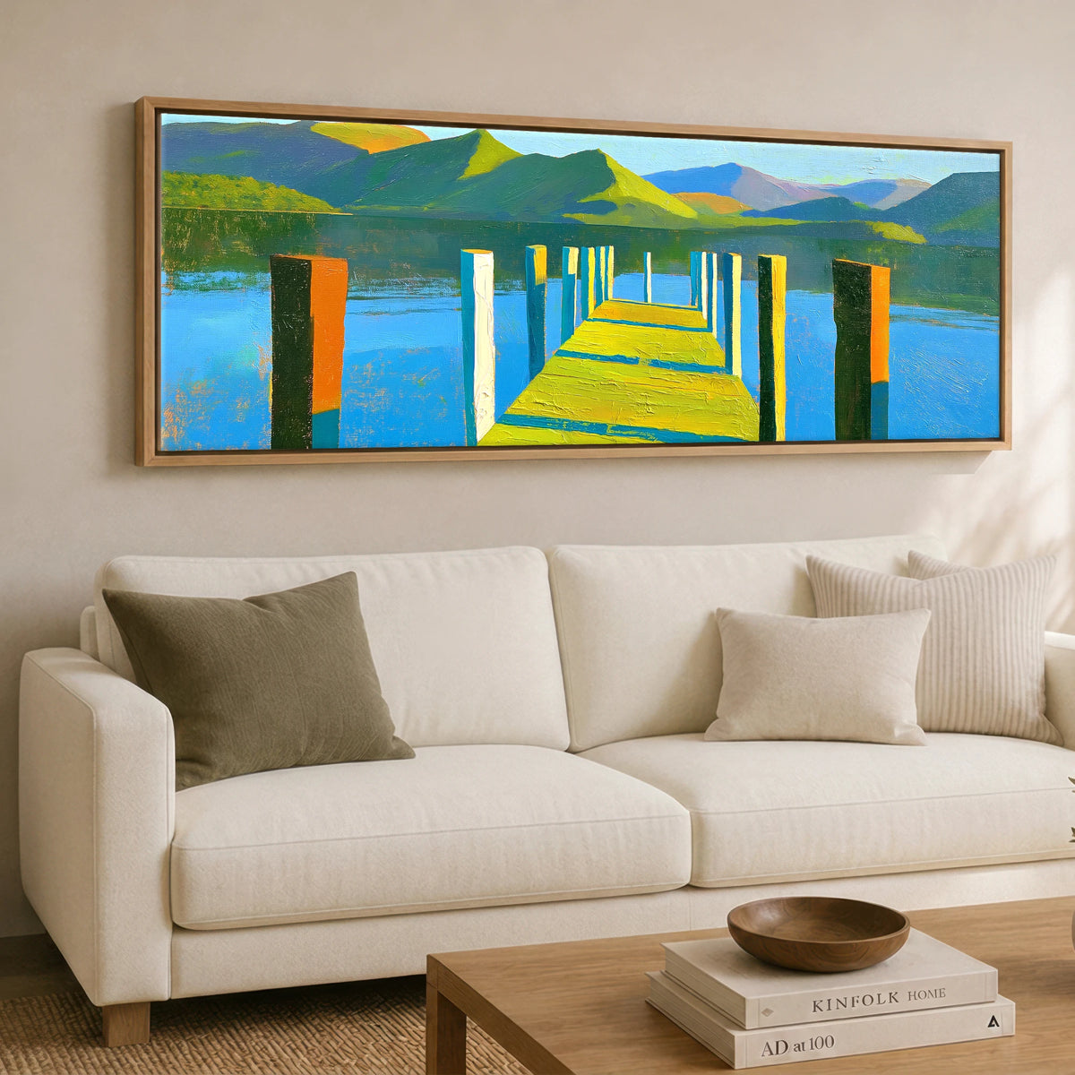 Sunlit Jetty and Vibrant Lakeland Fells Lake District Lake panoramic canvas wall art displayed above a sofa